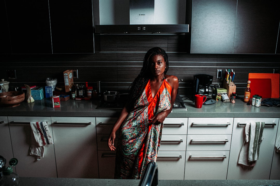 a woman standing in a kitchen
